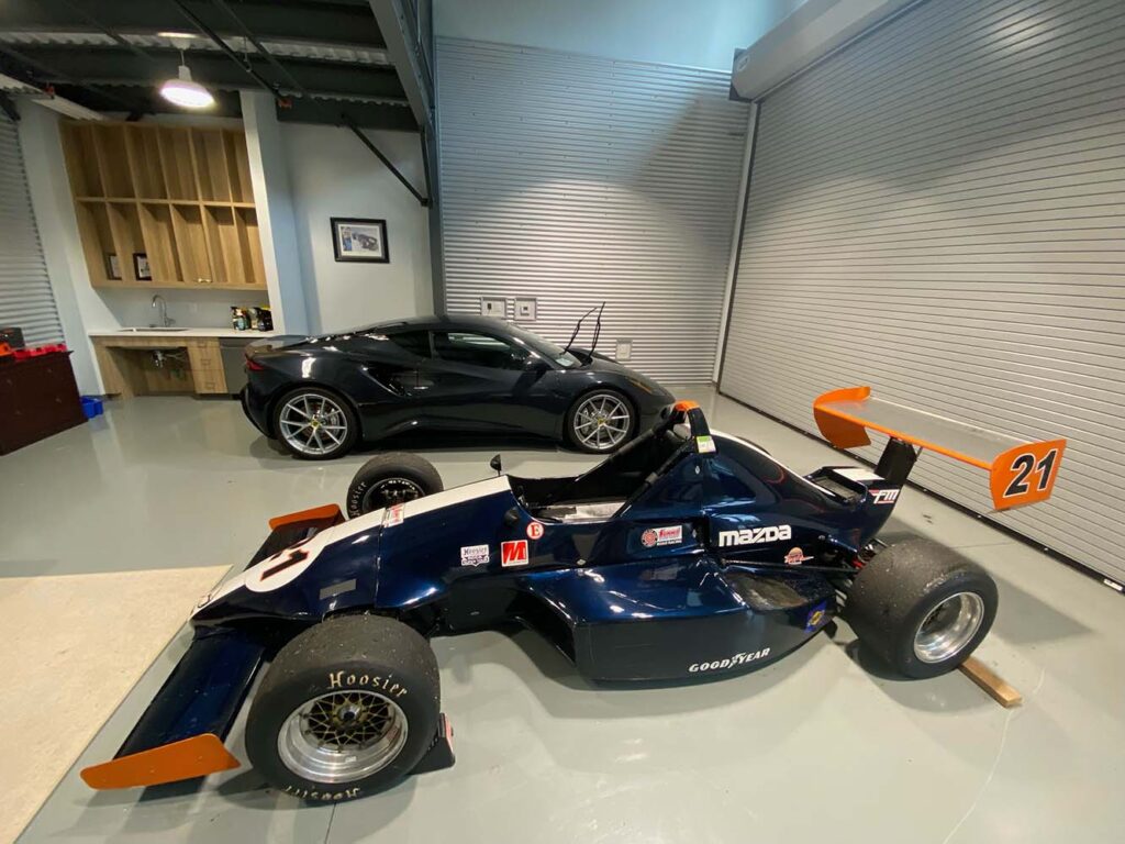 Our Garage, featuring a Lotus Emira First Edition and a 2004 Formula Mazda race car